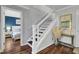 Staircase with hardwood floors and a bedroom in the background offering a glimpse of the relaxing atmosphere at 3651 Barton St, Johns Island, SC 29455