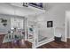 Staircase leading to dining area with modern chandeliers, wood floors, and horizontal cable railing at 3651 Barton St, Johns Island, SC 29455