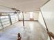 Unfinished basement with a garage door and access to upper level at 388 Benton Farm Rd, Walterboro, SC 29488
