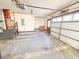 Spacious unfinished basement has stairs to upper level and a garage door at 388 Benton Farm Rd, Walterboro, SC 29488