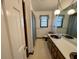 A bathroom with a double vanity and a window, offering potential for customization at 388 Benton Farm Rd, Walterboro, SC 29488