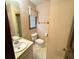 Small bathroom with toilet, sink, and walk-in shower at 388 Benton Farm Rd, Walterboro, SC 29488
