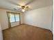 A bright bedroom with a window and neutral carpet offers a cozy space to personalize at 388 Benton Farm Rd, Walterboro, SC 29488