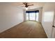 Bedroom features neutral carpet, a ceiling fan, and a bay window with curtains at 388 Benton Farm Rd, Walterboro, SC 29488