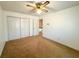 Bedroom featuring neutral carpet, a closet, and a ceiling fan, offering space for comfortable living at 388 Benton Farm Rd, Walterboro, SC 29488