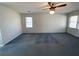 Spacious bedroom featuring a ceiling fan and natural light from the windows at 388 Benton Farm Rd, Walterboro, SC 29488