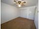 Bedroom featuring neutral carpet, a ceiling fan, and a closet with folding doors at 388 Benton Farm Rd, Walterboro, SC 29488