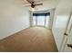 A bedroom with a bay window and a ceiling fan offers potential for renovation at 388 Benton Farm Rd, Walterboro, SC 29488