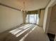 Dining room featuring carpet flooring, chandelier lighting and natural light at 388 Benton Farm Rd, Walterboro, SC 29488