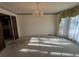 Dining room with carpet, chandelier lighting, and view to kitchen at 388 Benton Farm Rd, Walterboro, SC 29488