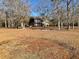 Beautiful two-story brick home with large front yard and mature trees, on a bright, sunny day at 388 Benton Farm Rd, Walterboro, SC 29488