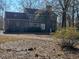 This two-story brick home showcases a long driveway and mature trees in a natural setting at 388 Benton Farm Rd, Walterboro, SC 29488