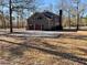 Detached two-car garage with a brick exterior and surrounded by trees and a large parking area at 388 Benton Farm Rd, Walterboro, SC 29488