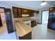 This kitchen features wood cabinetry, laminate countertops, white appliances, and vintage wallpaper at 388 Benton Farm Rd, Walterboro, SC 29488