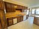 Kitchen boasting wooden cabinetry, white appliances, and vintage style design at 388 Benton Farm Rd, Walterboro, SC 29488