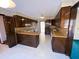 Kitchen with dark wood cabinets and a white appliance package at 388 Benton Farm Rd, Walterboro, SC 29488