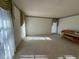 Bright living room with carpeted floors, large windows, and natural light at 388 Benton Farm Rd, Walterboro, SC 29488