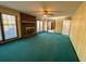 Bright living room features a brick fireplace, a ceiling fan, and large windows at 388 Benton Farm Rd, Walterboro, SC 29488