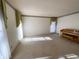 Bright living room with ample natural light and a piano, ready for your personal touches at 388 Benton Farm Rd, Walterboro, SC 29488