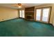 Cozy living room featuring a brick fireplace, windows, and a door leading to the exterior at 388 Benton Farm Rd, Walterboro, SC 29488