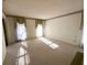 Large living room with carpet and large windows, offering a bright and airy feel at 388 Benton Farm Rd, Walterboro, SC 29488