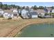 Aerial view of neighborhood homes overlooking a pond, showcasing community at 3920 Maidstone Dr, Mount Pleasant, SC 29466