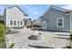 Beautiful backyard featuring a stone fire pit, ample seating, and well-maintained landscaping for outdoor enjoyment at 3920 Maidstone Dr, Mount Pleasant, SC 29466