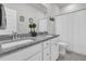 Well-lit bathroom showcasing double sinks with granite countertops, white cabinetry, and a shower with a neutral color scheme at 3920 Maidstone Dr, Mount Pleasant, SC 29466