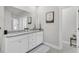 Elegant bathroom with dual sinks, granite countertops, and a decorative mirror at 3920 Maidstone Dr, Mount Pleasant, SC 29466
