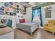 Stylish bedroom with unique record cover decor, a comfy bed, and lots of light for a fun and inviting space at 3920 Maidstone Dr, Mount Pleasant, SC 29466