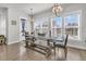 Dining space bathed in natural light, featuring a large wooden table and bench seating at 3920 Maidstone Dr, Mount Pleasant, SC 29466