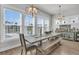 Bright dining area with large windows and stylish lighting fixtures at 3920 Maidstone Dr, Mount Pleasant, SC 29466