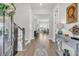 Elegant foyer featuring hardwood floors, staircase, and decorative console table at 3920 Maidstone Dr, Mount Pleasant, SC 29466