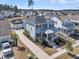Two-story home with welcoming front porch, complimented by lush landscaping and a paved driveway at 3920 Maidstone Dr, Mount Pleasant, SC 29466