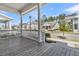View from porch showcasing columns, wood flooring, and a residential street at 3920 Maidstone Dr, Mount Pleasant, SC 29466
