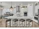 Spacious kitchen with white cabinets, stainless steel appliances, and large island with seating, perfect for gathering at 3920 Maidstone Dr, Mount Pleasant, SC 29466