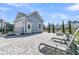 Backyard features a detached garage, stone fire pit, and sun loungers at 3920 Maidstone Dr, Mount Pleasant, SC 29466