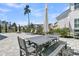Outdoor dining area with patio furniture and landscaping next to the lake at 3920 Maidstone Dr, Mount Pleasant, SC 29466