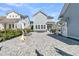 Spacious backyard patio with lounge chairs and a stone fire pit at 3920 Maidstone Dr, Mount Pleasant, SC 29466