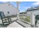 Inviting front porch featuring rocking chair, wooden floors and white railings at 3920 Maidstone Dr, Mount Pleasant, SC 29466