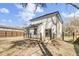 View of the back exterior of the house including a wooden deck with black railings at 397 Parkdale Dr, Charleston, SC 29414