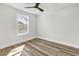 Cozy bedroom with a window, wood-look floors, and neutral paint, creating a peaceful and inviting space at 397 Parkdale Dr, Charleston, SC 29414