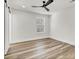 This is a bright bedroom with wood-look vinyl floors, modern ceiling fan, and natural light from the window at 397 Parkdale Dr, Charleston, SC 29414
