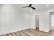 Bright bedroom featuring wood-look flooring, a modern ceiling fan, and white trim throughout at 397 Parkdale Dr, Charleston, SC 29414