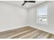 Bright bedroom with wood-look floors and a large window providing natural light and neighborhood views at 397 Parkdale Dr, Charleston, SC 29414