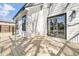 View of a light wood deck and double doors on a modern white house at 397 Parkdale Dr, Charleston, SC 29414