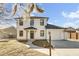 Charming two-story home featuring white siding, black trim, inviting front porch and a one-car garage at 397 Parkdale Dr, Charleston, SC 29414