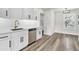 Modern kitchen featuring white cabinets, stainless steel appliances, and a gold faucet at 397 Parkdale Dr, Charleston, SC 29414