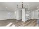 Open-concept living room with wood floors and a snack bar area at 397 Parkdale Dr, Charleston, SC 29414