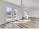 Open floor plan with wood-look floors, white walls, natural light and access to a back patio at 397 Parkdale Dr, Charleston, SC 29414